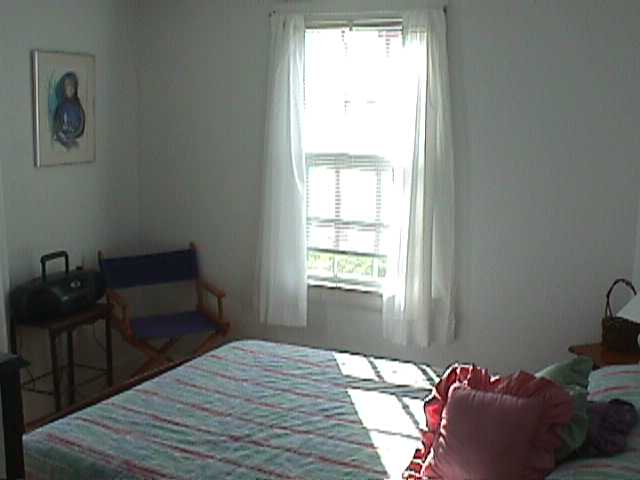 Sunny and bright master bedroom and second bedroom has twin beds